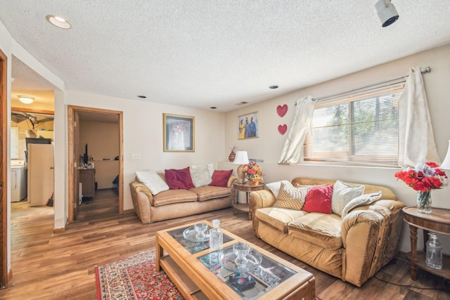 6522 Kilmer Ln N, Maple Grove, MN 55369 - living area with a textured ceiling, washer / dryer, wood finished floors, and recessed lighting