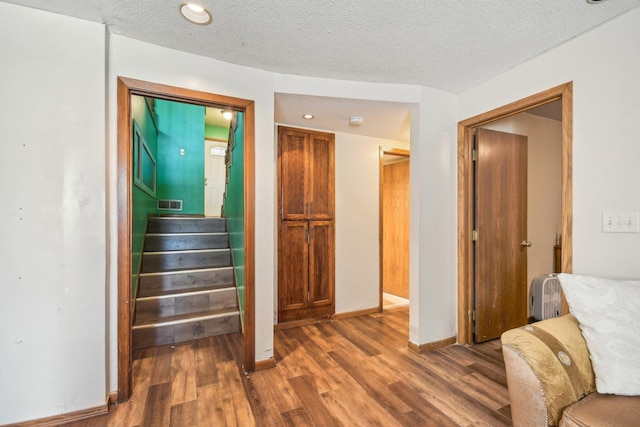 6522 Kilmer Ln N, Maple Grove, MN 55369 - stairway with wood finished floors, baseboards, and a textured ceiling