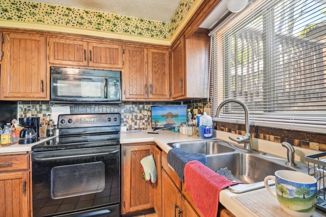 6522 Kilmer Ln N, Maple Grove, MN 55369 - kitchen with black appliances, a sink, light countertops, and decorative backsplash