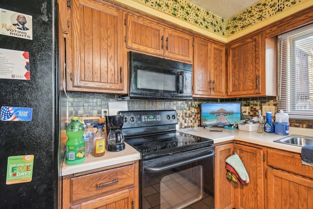 6522 Kilmer Ln N, Maple Grove, MN 55369 - kitchen featuring black appliances, light countertops, backsplash, and brown cabinetry