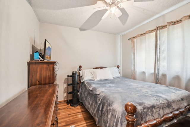 6522 Kilmer Ln N, Maple Grove, MN 55369 - bedroom with wood finished floors, a textured ceiling, and a ceiling fan