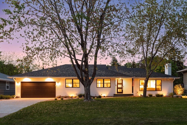 4512 Andover Rd, Edina, MN 55435 - ranch-style house featuring concrete driveway, a lawn, a garage, and a chimney