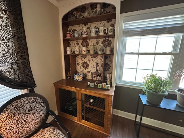 detailed view of wood finished floors and crown molding