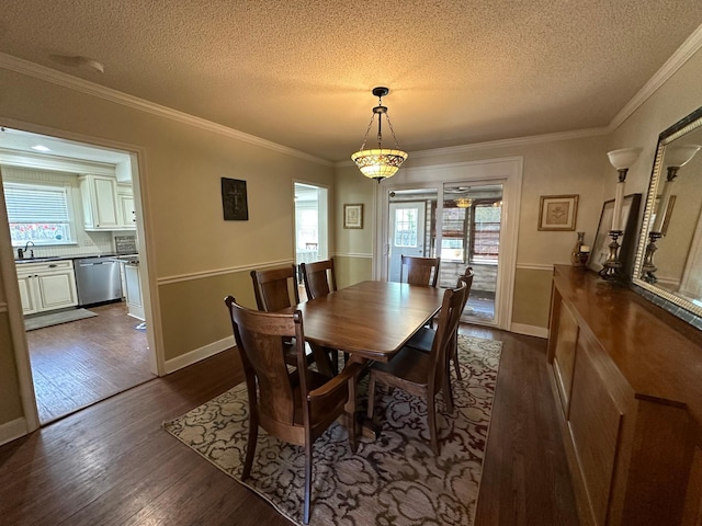 dining area featuring a textured ceiling, dark wood-style floors, crown molding, and baseboards