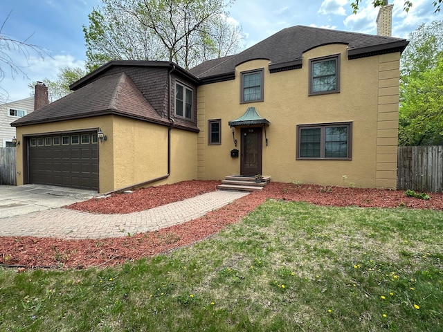 view of front of property featuring stucco siding, a chimney, an attached garage, and concrete driveway