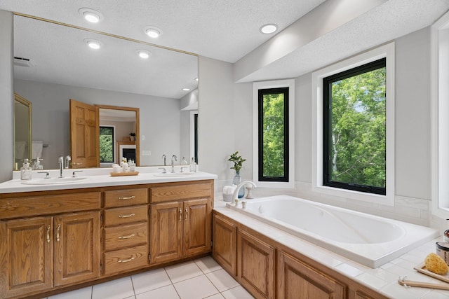 4255 Wexford Way, Eagan, MN 55122 - full bath featuring double vanity, a bath, a textured ceiling, and tile patterned floors