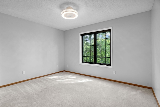 4255 Wexford Way, Eagan, MN 55122 - carpeted spare room with baseboards and a textured ceiling