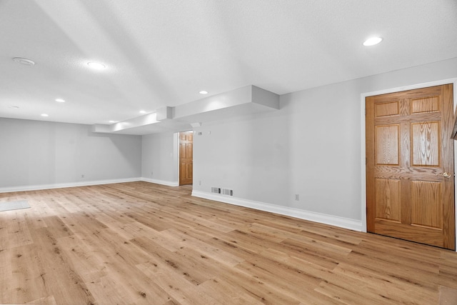 4255 Wexford Way, Eagan, MN 55122 - finished basement featuring light wood finished floors, recessed lighting, and a textured ceiling