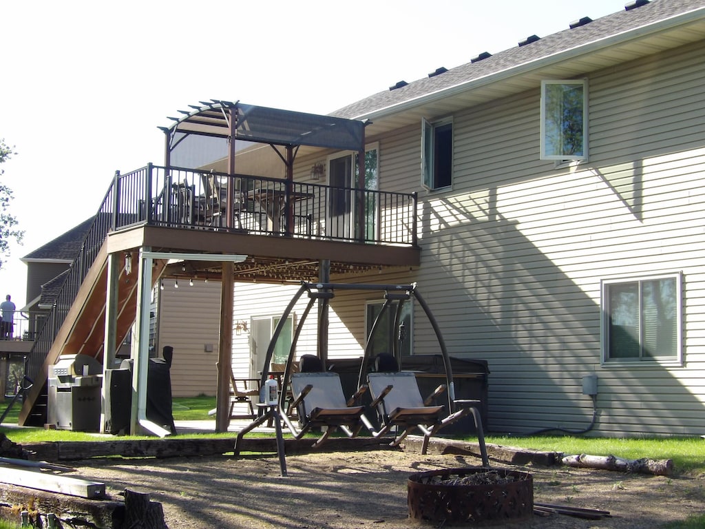 back of property with a wooden deck