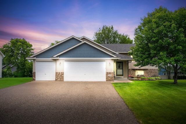 1034 111th Ave NE, Blaine, MN 55434 - craftsman house with driveway, a yard, and brick siding
