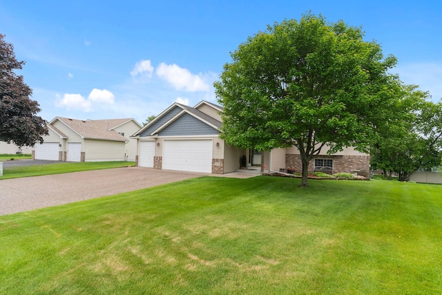 1034 111th Ave NE, Blaine, MN 55434 - view of front of property featuring a front yard, asphalt driveway, and a garage