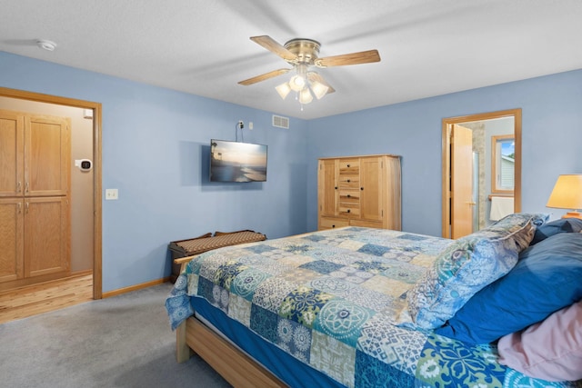 1034 111th Ave NE, Blaine, MN 55434 - bedroom with light carpet, baseboards, and a ceiling fan