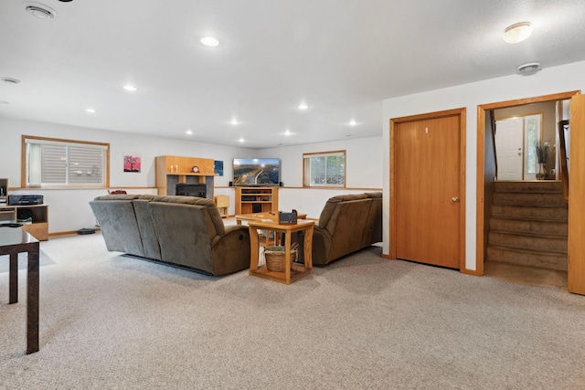 1034 111th Ave NE, Blaine, MN 55434 - living room with carpet floors, a fireplace, stairs, and recessed lighting
