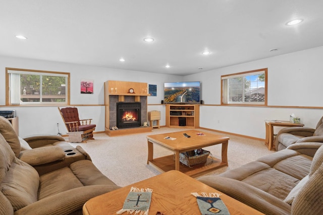1034 111th Ave NE, Blaine, MN 55434 - carpeted living area with recessed lighting, a tiled fireplace, and baseboards