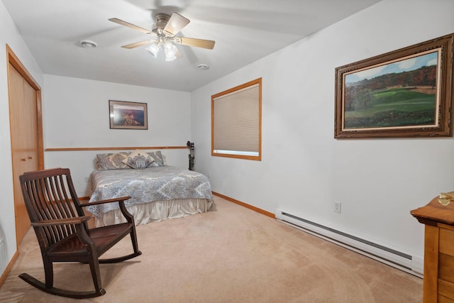 1034 111th Ave NE, Blaine, MN 55434 - carpeted bedroom with a baseboard radiator, baseboards, and a ceiling fan