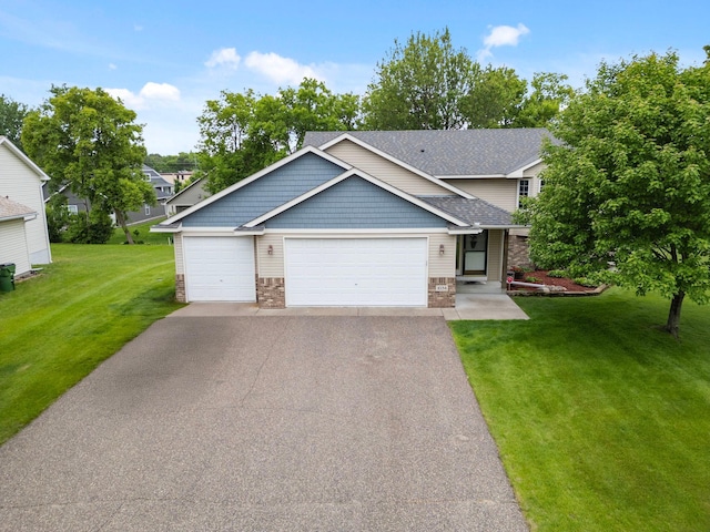 1034 111th Ave NE, Blaine, MN 55434 - view of front facade with a front lawn, driveway, stone siding, an attached garage, and roof with shingles