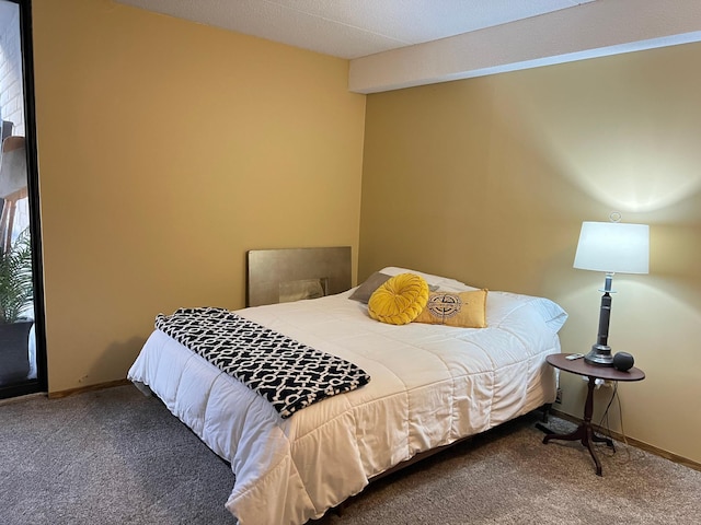 carpeted bedroom with baseboards