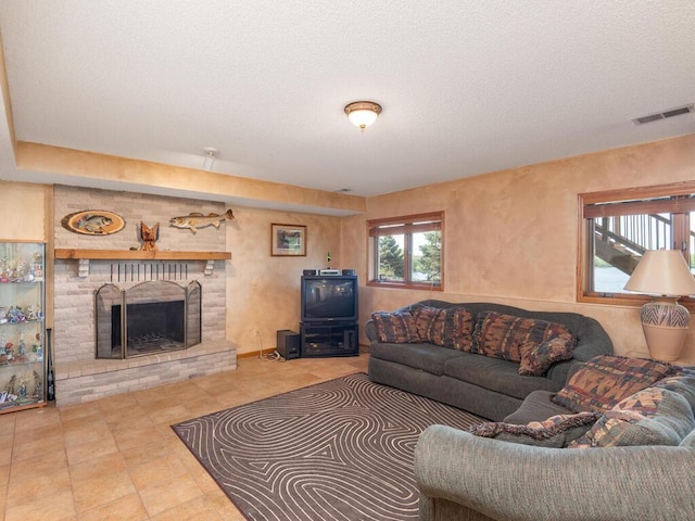 15825 Garden View Dr, Apple Valley, MN 55124 - living room featuring a fireplace and a textured ceiling