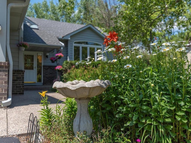 15825 Garden View Dr, Apple Valley, MN 55124 - exterior space featuring a shingled roof and brick siding
