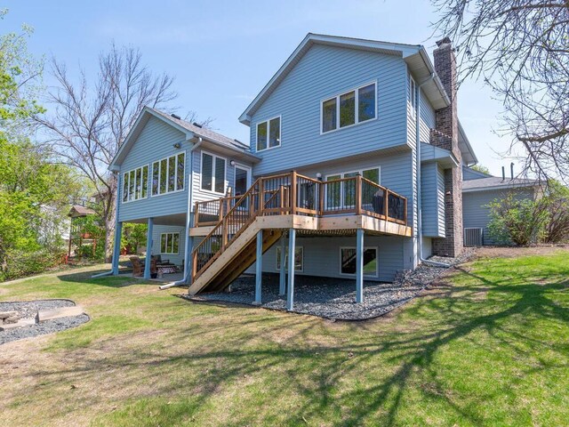 15825 Garden View Dr, Apple Valley, MN 55124 - back of property featuring a chimney, a deck, stairway, and a yard