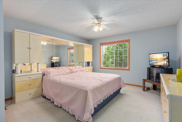 9230 Cheney Trl, Inver Grove Heights, MN 55076 - bedroom featuring light carpet, baseboards, ceiling fan, and a textured ceiling