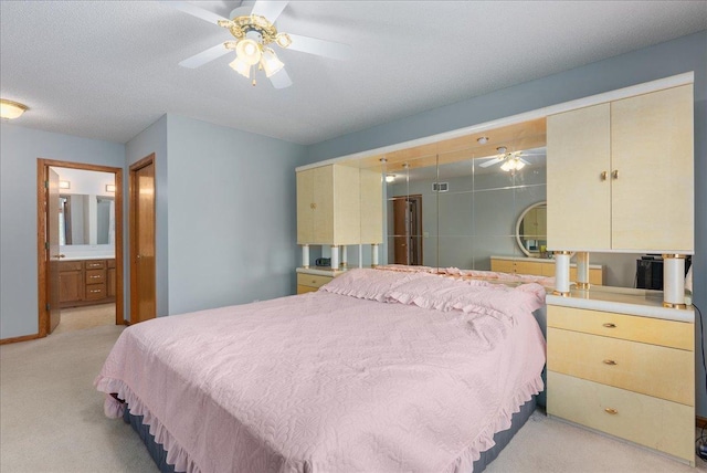 9230 Cheney Trl, Inver Grove Heights, MN 55076 - bedroom with light carpet, connected bathroom, and ceiling fan