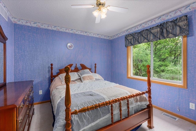 9230 Cheney Trl, Inver Grove Heights, MN 55076 - carpeted bedroom featuring baseboards, a ceiling fan, and a textured ceiling