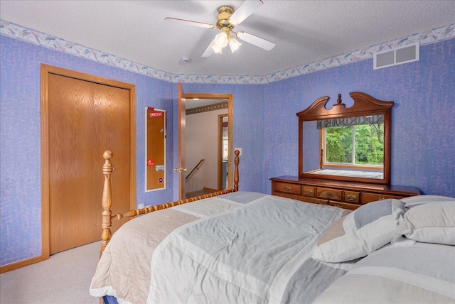 9230 Cheney Trl, Inver Grove Heights, MN 55076 - bedroom featuring carpet floors, a textured ceiling, wallpapered walls, and a ceiling fan