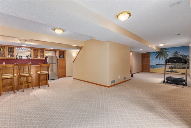9230 Cheney Trl, Inver Grove Heights, MN 55076 - indoor dry bar featuring freestanding refrigerator, light carpet, and baseboards