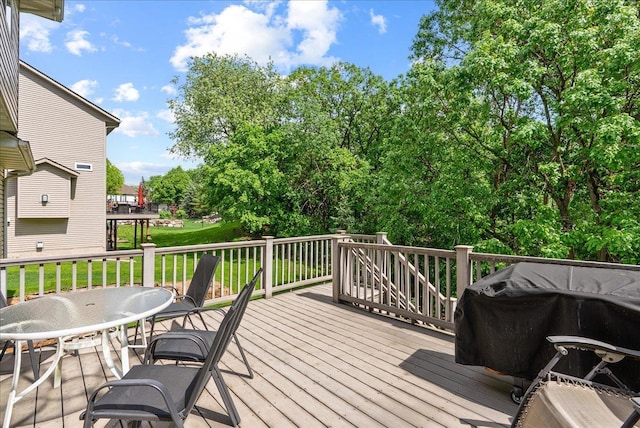 9230 Cheney Trl, Inver Grove Heights, MN 55076 - wooden terrace featuring a grill and a lawn
