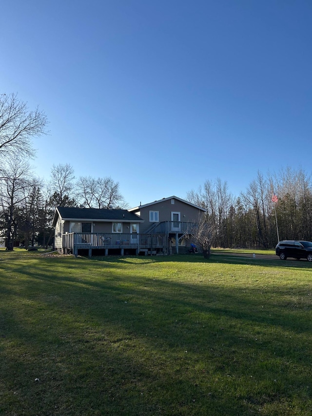 7424 Ely Lake Dr, Fayal Twp, MN 55734 - view of grassy yard with a wooden deck