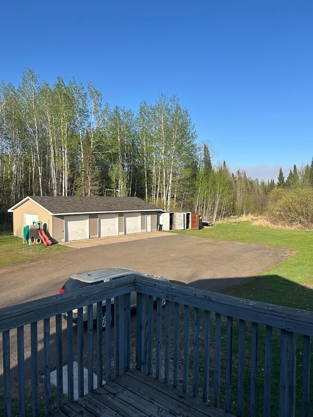 7424 Ely Lake Dr, Fayal Twp, MN 55734 - deck with an outdoor structure and a detached garage