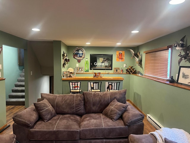 7424 Ely Lake Dr, Fayal Twp, MN 55734 - living room with baseboard heating, wood finished floors, stairway, and recessed lighting