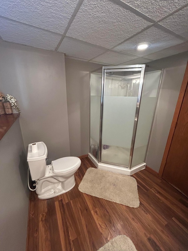 7424 Ely Lake Dr, Fayal Twp, MN 55734 - full bathroom with toilet, a shower stall, wood finished floors, and baseboards