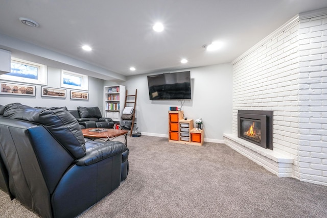 carpeted living area featuring a brick fireplace, recessed lighting, and baseboards