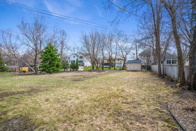 view of yard with a shed and an outbuilding