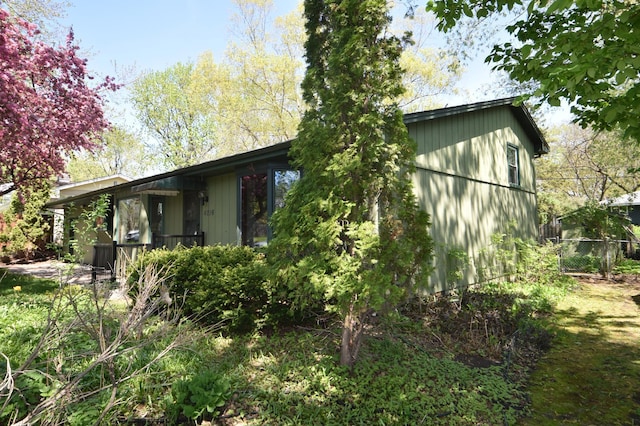 view of property exterior featuring fence