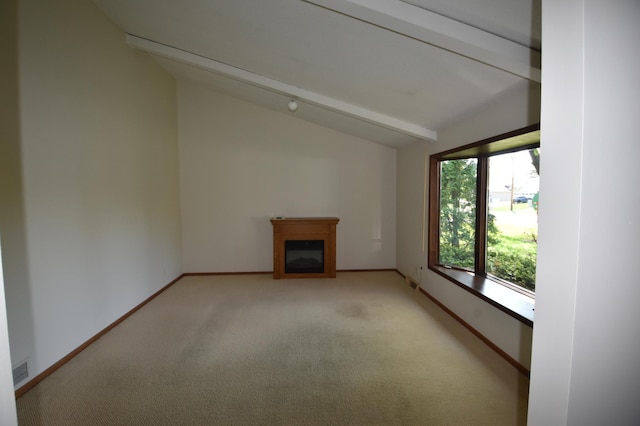 unfurnished living room featuring carpet floors, baseboards, and a fireplace