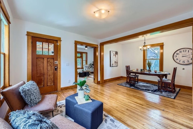 984 Milton St N, Saint Paul, MN 55103 - living area with a chandelier and light wood finished floors