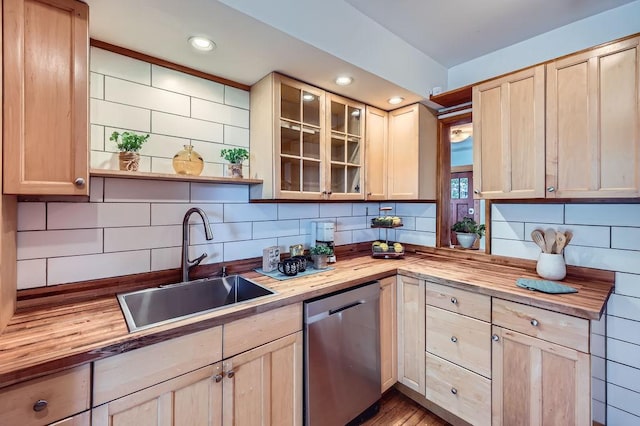 984 Milton St N, Saint Paul, MN 55103 - kitchen with butcher block countertops, stainless steel dishwasher, light brown cabinets, tasteful backsplash, and recessed lighting