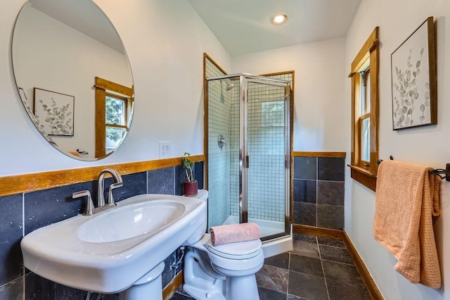 984 Milton St N, Saint Paul, MN 55103 - full bathroom featuring a shower stall, tile walls, recessed lighting, and stone finish flooring