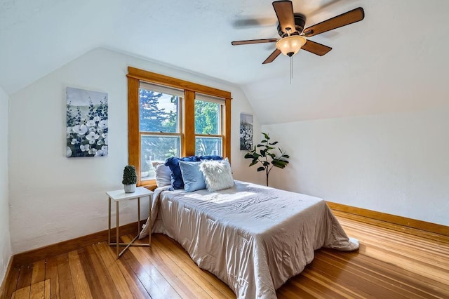 984 Milton St N, Saint Paul, MN 55103 - bedroom featuring vaulted ceiling, hardwood / wood-style flooring, and a ceiling fan
