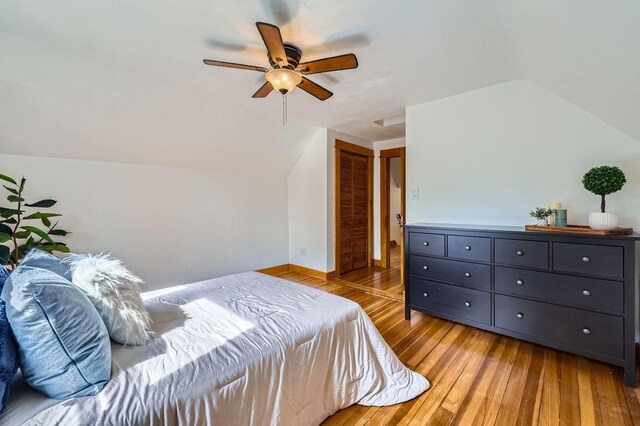 984 Milton St N, Saint Paul, MN 55103 - bedroom with lofted ceiling, light wood finished floors, a closet, and a ceiling fan