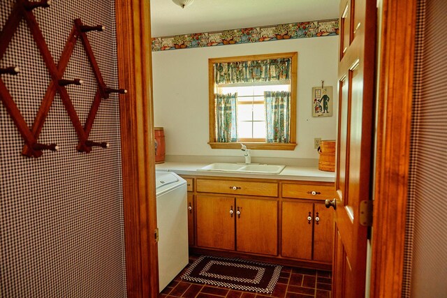 16865 Terrey Pine Dr, Eden Prairie, MN 55347 - laundry area with cabinet space, washer / dryer, and brick patterned flooring