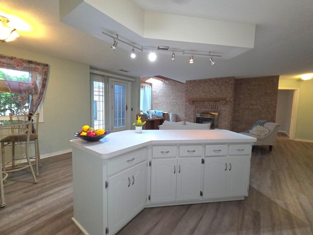 350 Oakwood Dr Unit 4, New Brighton, MN 55112 - kitchen featuring light wood-style flooring, open floor plan, baseboards, and brick wall