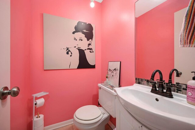 3214 Blaisdell Ave, Minneapolis, MN 55408 - bathroom featuring toilet, vanity, and tile patterned floors