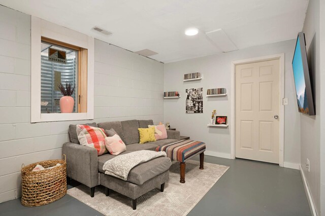 3214 Blaisdell Ave, Minneapolis, MN 55408 - living area featuring concrete flooring, baseboards, and recessed lighting