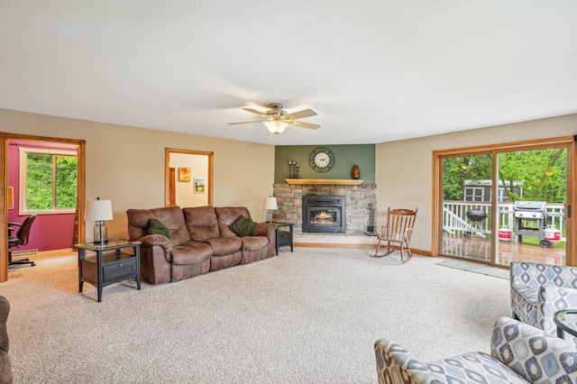 W10005 710th Ave, River Falls, WI 54022 - living area with carpet, healthy amount of natural light, a ceiling fan, and a fireplace