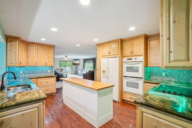 W10005 710th Ave, River Falls, WI 54022 - kitchen featuring white appliances, a sink, butcher block countertops, decorative backsplash, and recessed lighting