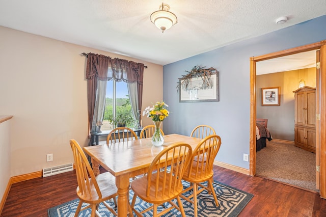 W10005 710th Ave, River Falls, WI 54022 - dining space featuring wood finished floors, baseboards, and a textured ceiling